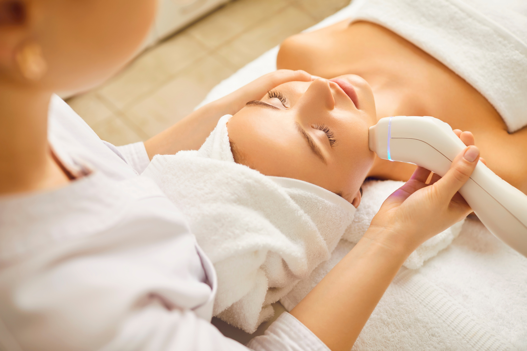 Woman Getting a Facial Treatment at the Clinic